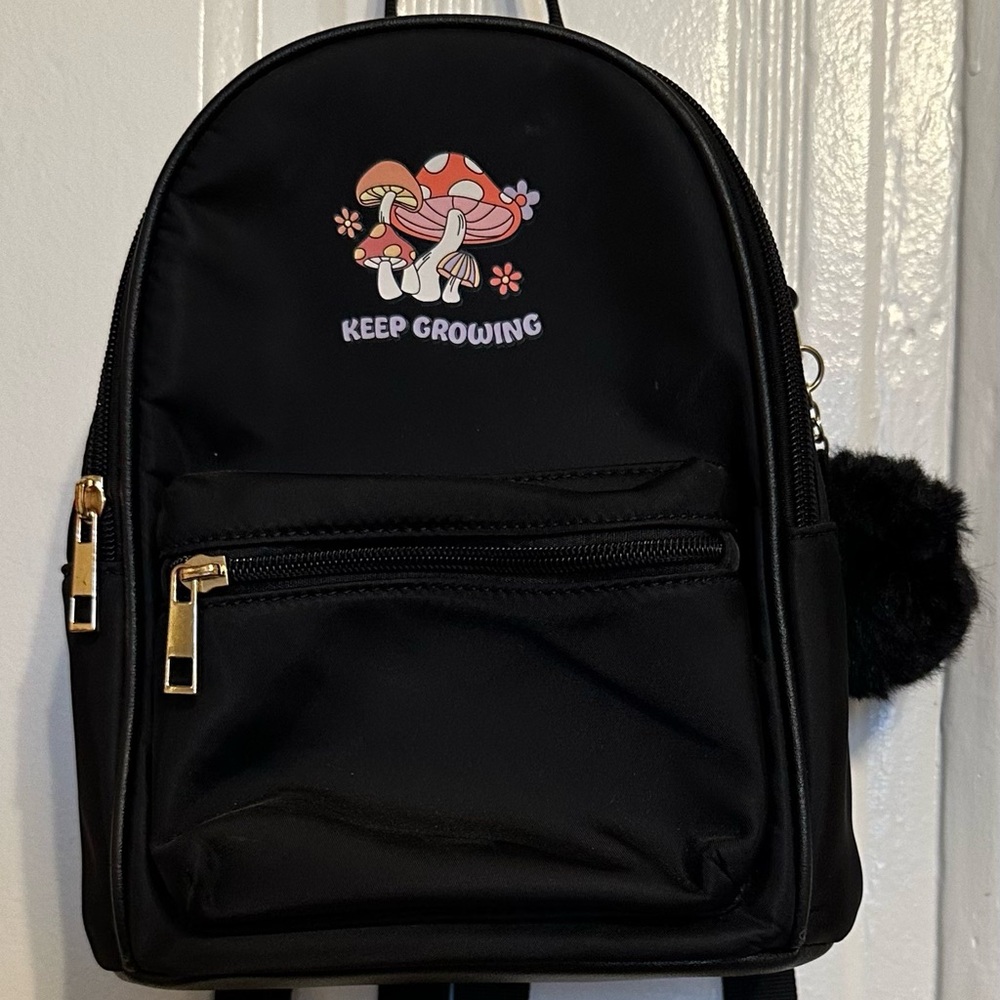 Black “keep growing” Backpack